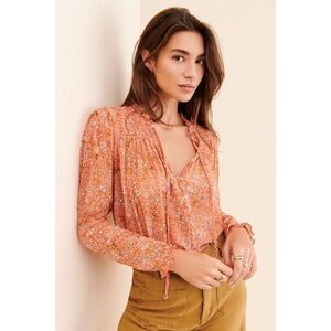 Free People Lela blouse retro inspired floral print orange background